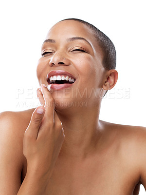 Buy stock photo Studio shot of a beautiful young woman touching her face while standing against a white background