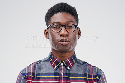 Buy stock photo Face portrait, serious geek and black man in studio isolated on white background. African, nerd and male person with glasses from South Africa with fashion, style and pose with clothes for confidence
