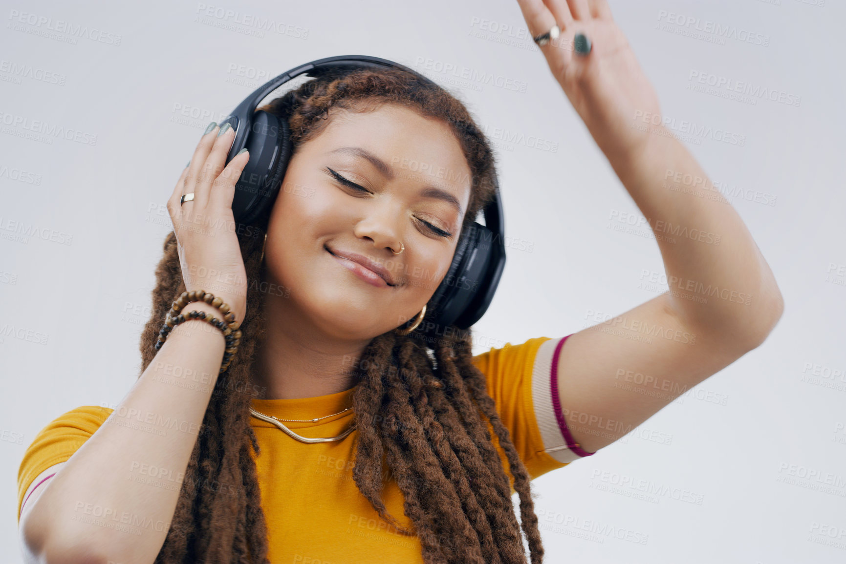 Buy stock photo Woman, studio or dance with headphones in closeup for music, streaming or listening with happiness. Female student or celebrate on backdrop with audio for podcast, happy with sound wave in California