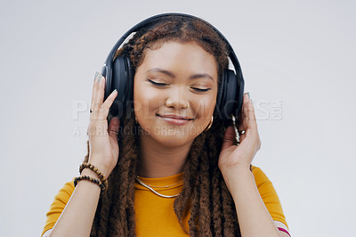 Buy stock photo Headphones, dance or calm girl streaming music in studio for singing on grey background to relax. Gen z, podcast or woman listening to radio playlist, sound or song audio on an online subscription