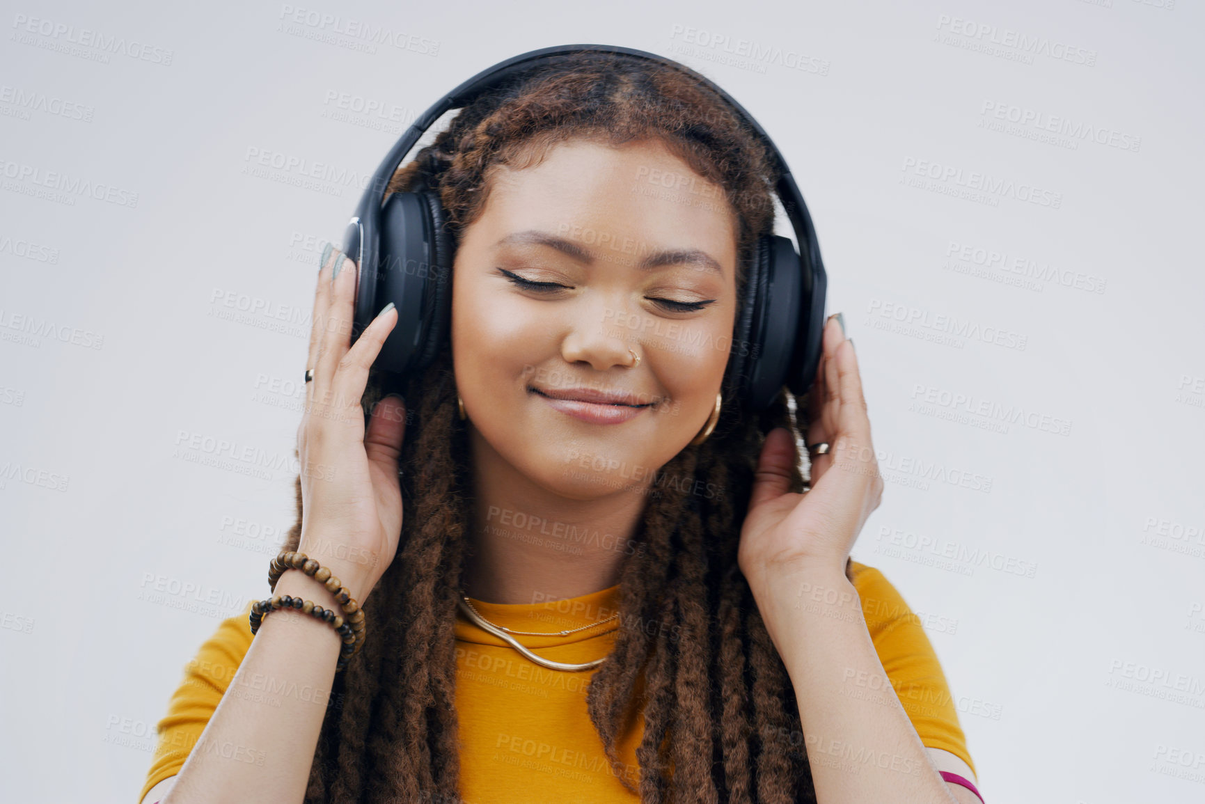 Buy stock photo Headphones, dance or calm girl streaming music in studio for singing on grey background to relax. Gen z, podcast or woman listening to radio playlist, sound or song audio on an online subscription