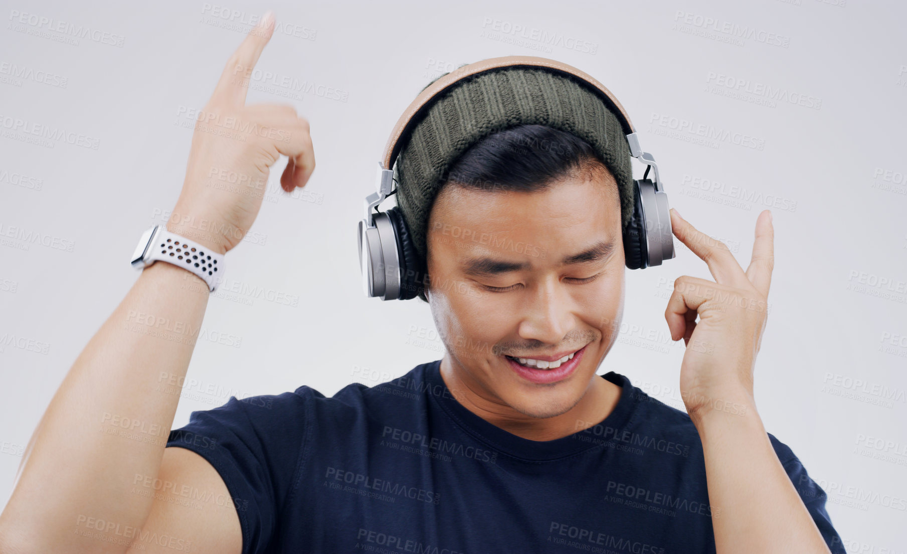 Buy stock photo Studio shot of a handsome young man dancing against a grey background