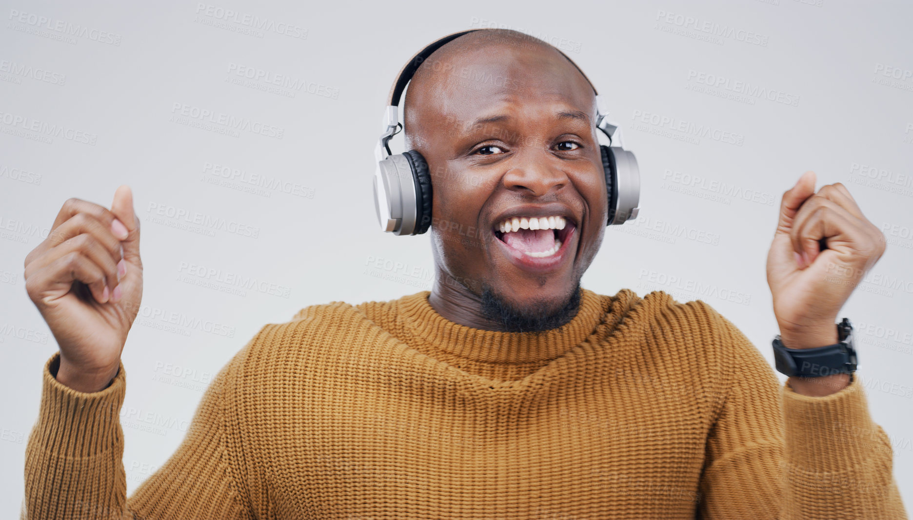 Buy stock photo Studio shot of a handsome young man dancing against a grey background