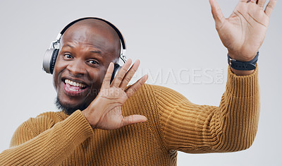 Buy stock photo Portrait, dance or happy black man in music headphones in studio for singing on grey background to relax. Model, podcast or African person listening to radio playlist, sound or song audio with smile