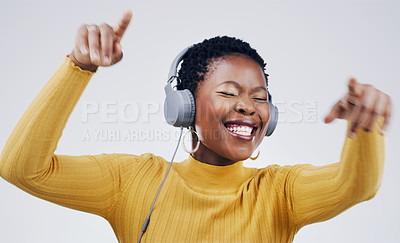 Buy stock photo Dance, happy and a black woman with music on headphones isolated on a white background in studio. Smile, crazy and an African girl listening to audio, dancing and streaming radio for happiness