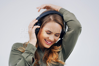 Buy stock photo Woman, music or dance with headphones in closeup for beat, streaming or listening with happiness. Female student or celebrate on studio background with audio for podcast, happy or sound with digital