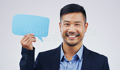Buy stock photo Happy asian man, portrait and speech bubble for social media, question or FAQ with smile against a white studio background. Excited male person smiling with sign for comment, message or mockup space