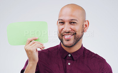 Buy stock photo Happy man, portrait and smile with speech bubble for question, social media or FAQ against white studio background. Male person smiling with shape, symbol or sign for comment, message or mockup space