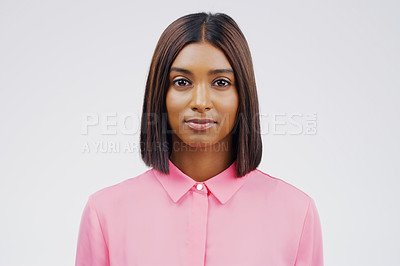 Buy stock photo Portrait, serious and hair with an indian woman in studio on a gray background for beauty or fashion. Face, focus and natural with an attractive young female person feeling confident in trendy style