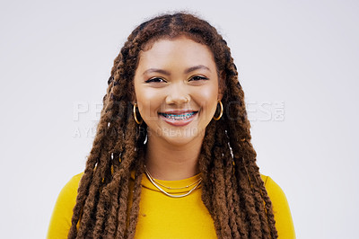 Buy stock photo Happy, smile and portrait of a woman with braces isolated on a white background in a studio. Happiness, confident and a face headshot of a young girl with dreadlocks, confidence and positivity