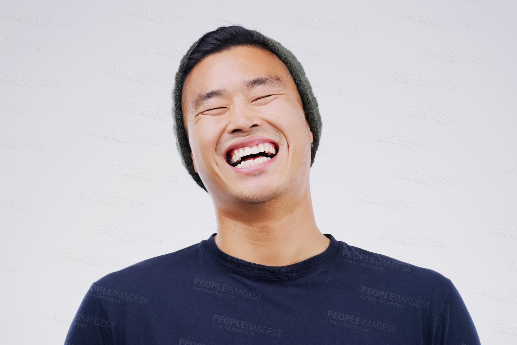 Buy stock photo Casual, comedy and man laughing in a studio for joke, comic humor or funny story. Happiness, smile and face of an Asian male person with a positive and joyful facial expression by white background.