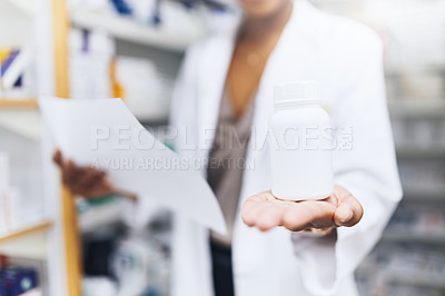 Buy stock photo Cropped shot of a female pharmacist recommending medication