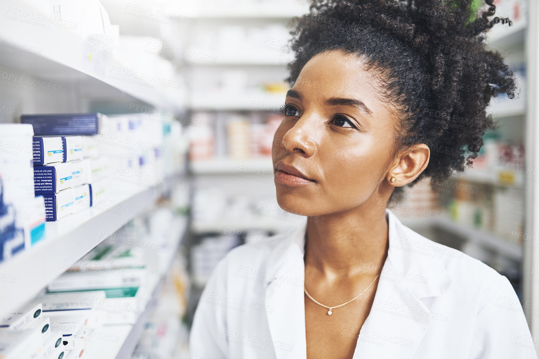 Buy stock photo Black woman, thinking and pharmacist with shelf in clinic of medicine stock, check and information for prescription. Healthcare, female person and pills choice, medical inventory and pharmacy advice