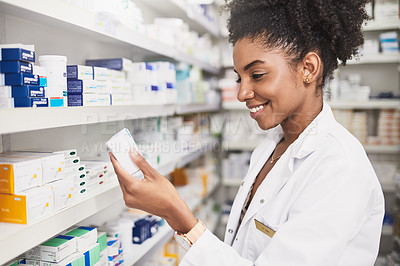 Buy stock photo Pharmacist, black woman and reading product in clinic for medicine stock, ingredients and check information on label. Smile, female person and pills box for medical inventory, inspection and retail