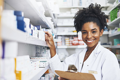 Buy stock photo Cropped shot of a female pharmacist holding a clipboard