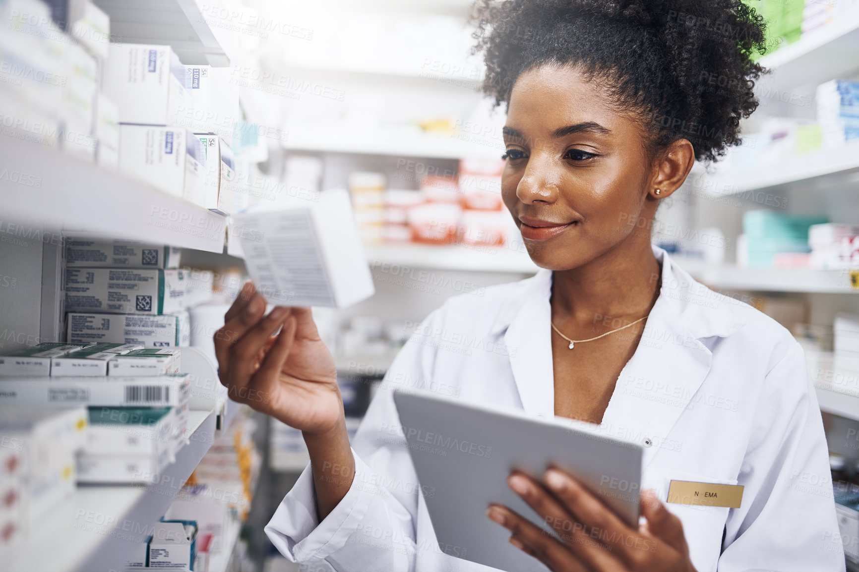 Buy stock photo Black woman, tablet and check inventory at pharmacy for medicine, stock and reading box label. Tech, pharmacist and medical worker with drugs for online prescription order, information or healthcare