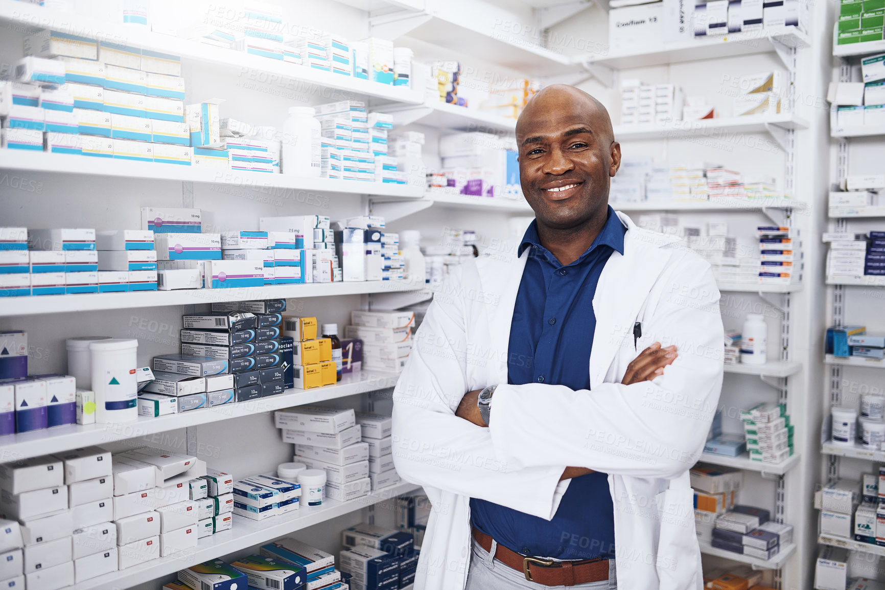 Buy stock photo Cropped shot of a confident man working as a pharmacist in a chemist