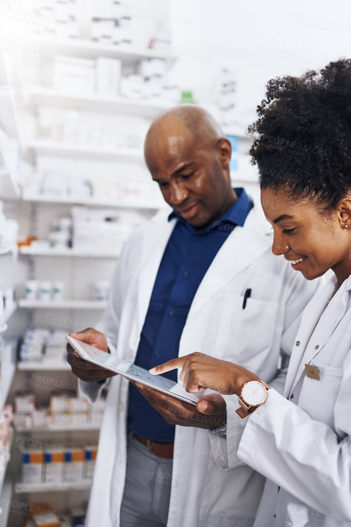 Buy stock photo Healthcare, black people and pharmacist or tablet in clinic of medicine stock, reading and check for label information. Woman, man and digital Telehealth for medical inventory, inspection and retail