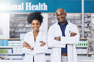 Buy stock photo Portrait of two pharmacist standing with their arms crossed