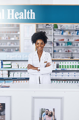 Buy stock photo Portrait of a female pharmacist standing with her arms crossed in a chemist