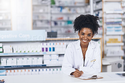 Buy stock photo Cropped shot of a confident young woman working as a pharmacist in a chemist