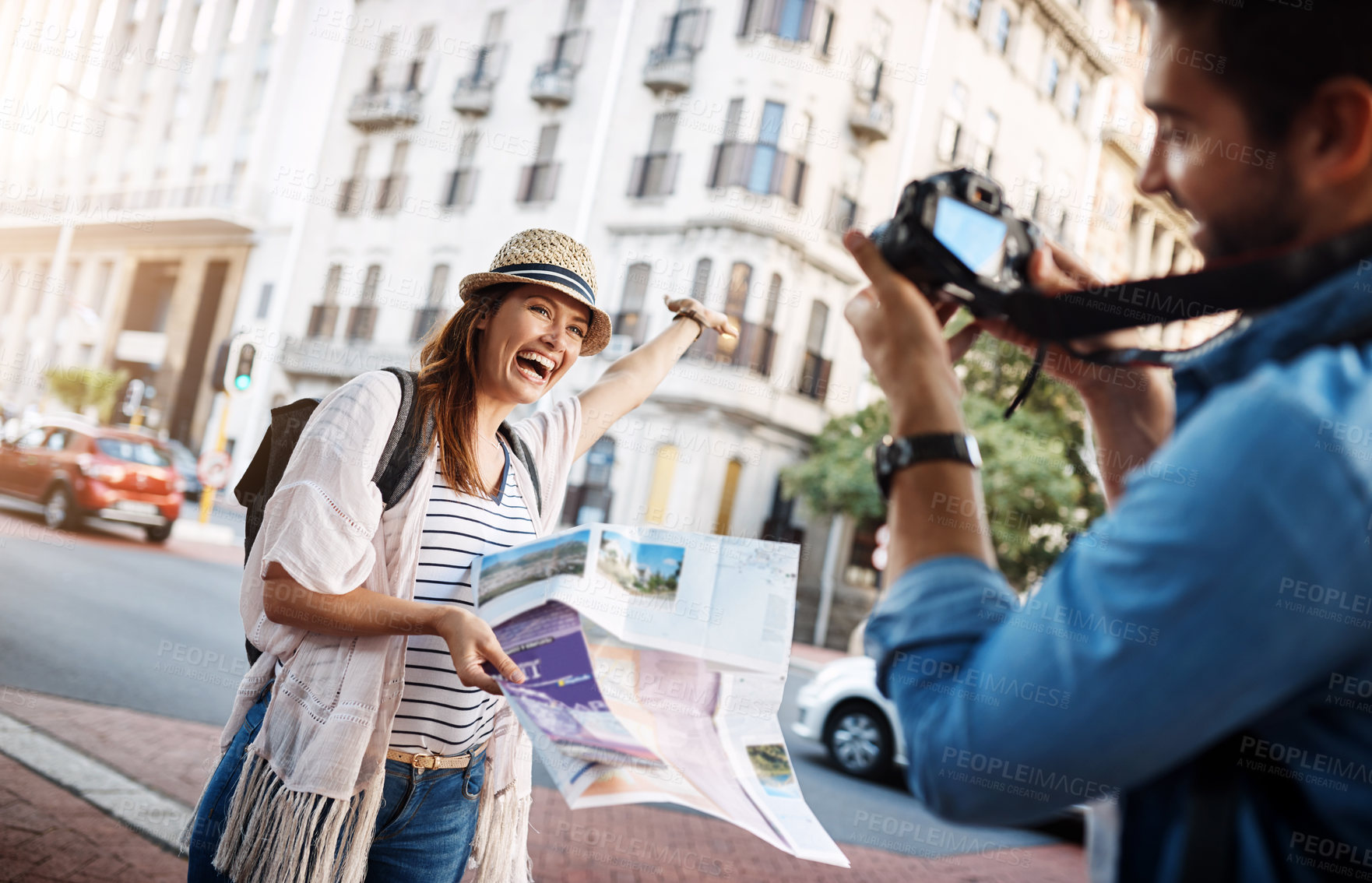 Buy stock photo Cropped shot of an attractive woman posing for a picture while out in a foreign city with her husband