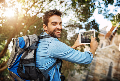 Buy stock photo Man, tourist and tablet for travel photo outdoor in nature with a backpack and smile. Portrait of male person with tech for hiking adventure, journey or vacation photography and freedom or happiness