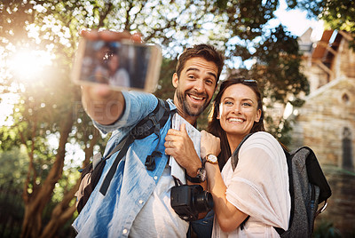 Buy stock photo Tourist couple, smile and selfie outdoor for travel in a city for vacation memory or happiness. Happy man and woman take picture on adventure, social media or holiday trip with freedom, love and care