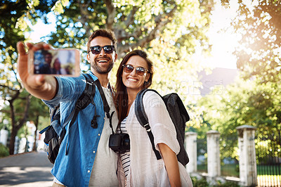 Buy stock photo Selfie, happy couple and outdoor for travel with a smile for holiday memory and happiness. Man and woman at a park with trees for adventure, journey or vacation photo and freedom with love and care