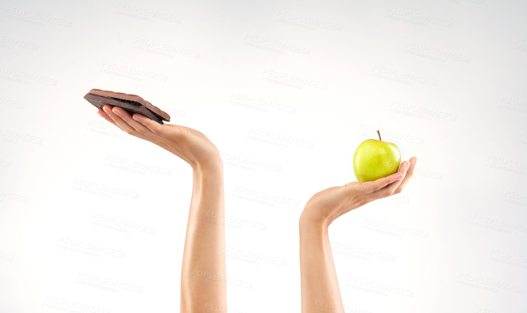 Buy stock photo Studio shot of an unrecognizable woman deciding between healthy and unhealthy foods against a grey background