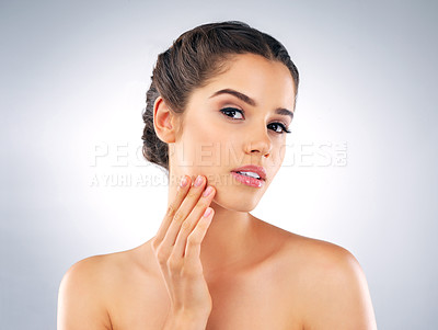 Buy stock photo Skincare, beauty and portrait of woman in studio for cosmetics, wellness and facial treatment. Dermatology, salon and isolated person with moisturizer, lotion and anti aging creme on blue background