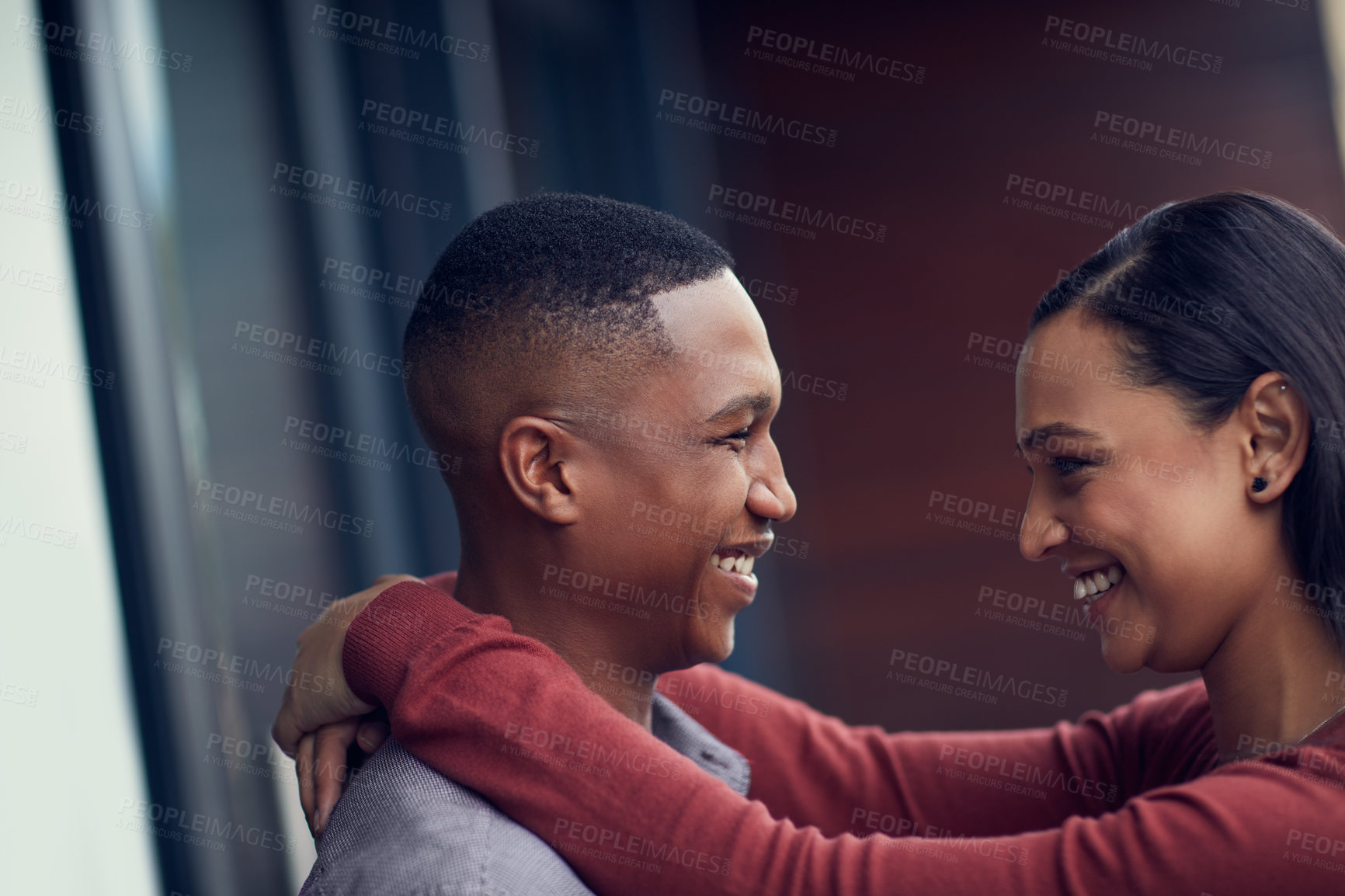 Buy stock photo Shot of a happy young couple sharing a romantic moment together