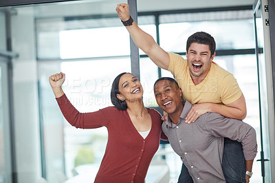 Buy stock photo Shot of a group of young businesspeople celebrating in a modern office