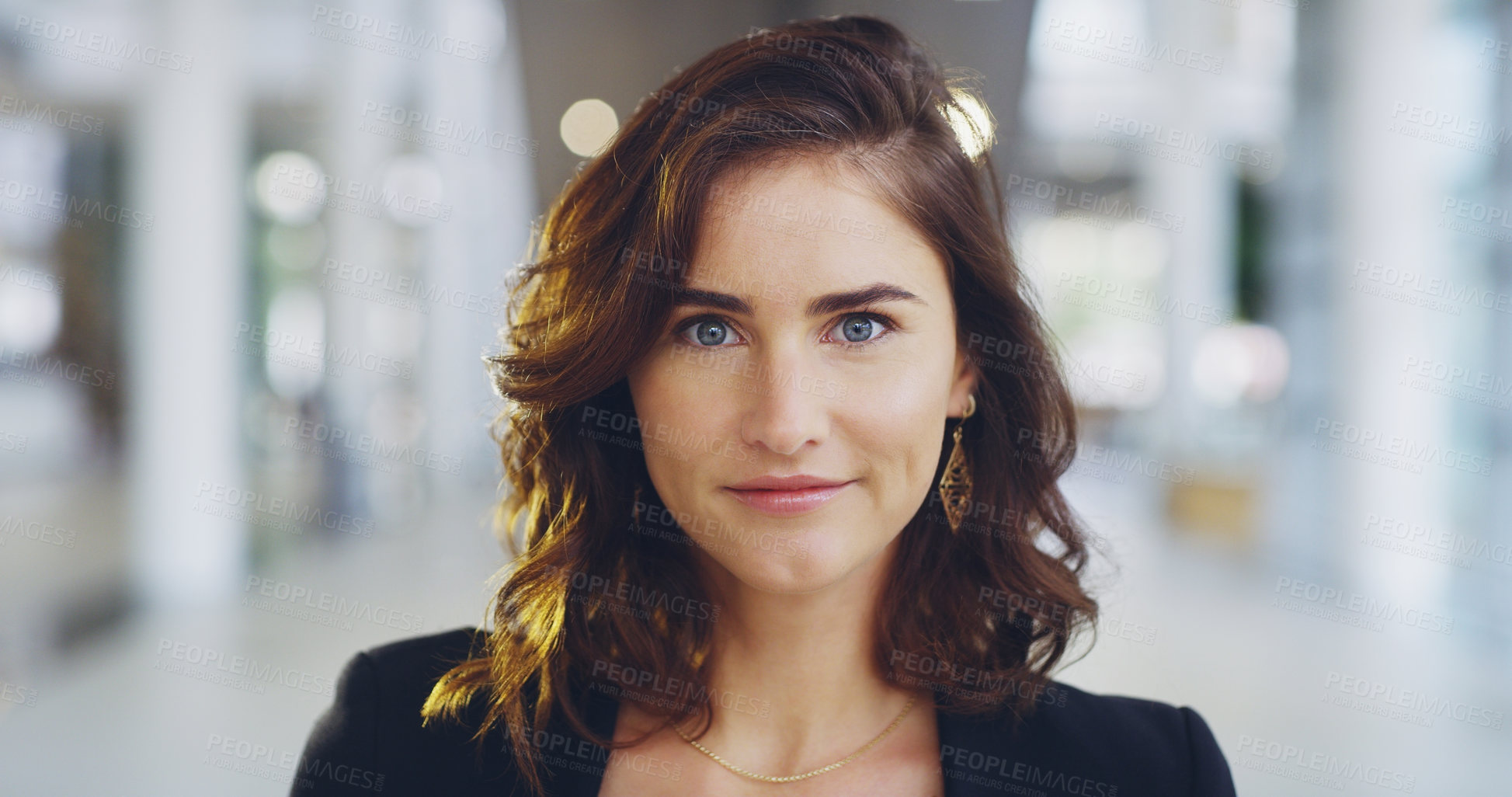 Buy stock photo Cropped shot of a confident young businesswoman working in a modern office