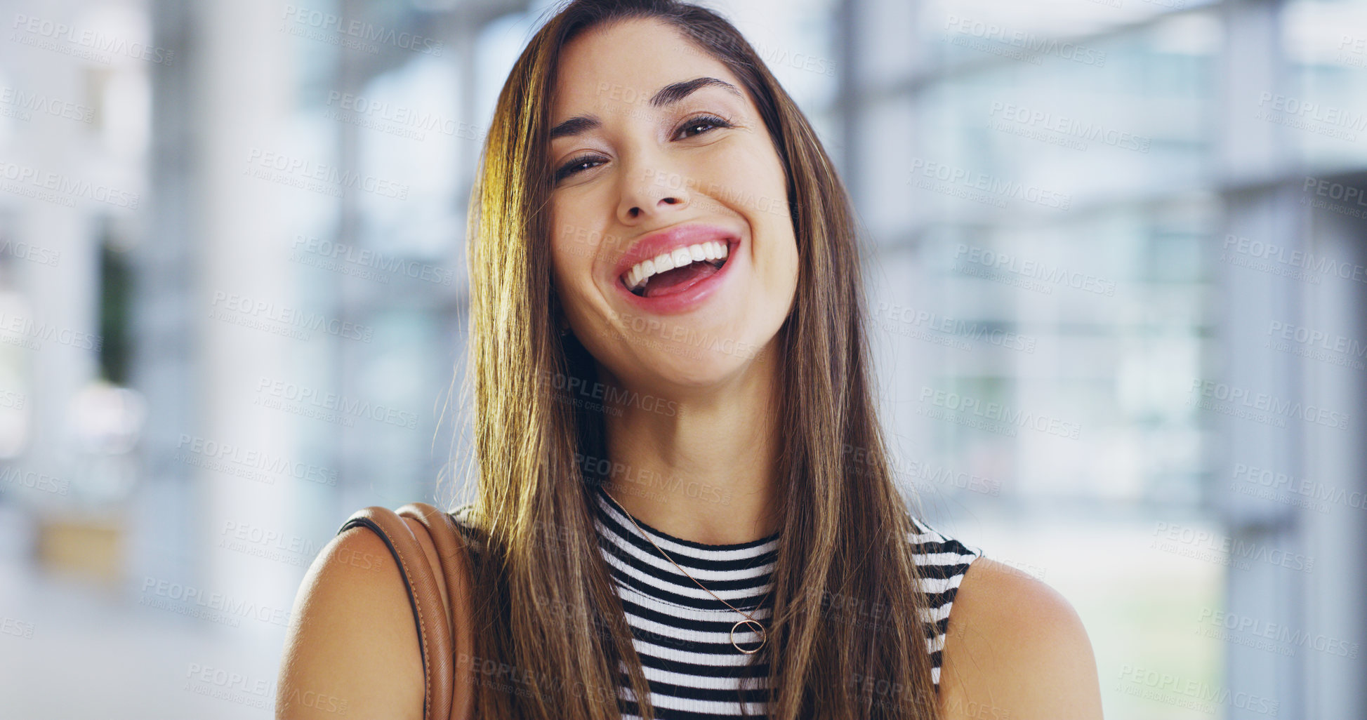 Buy stock photo Cropped shot of a confident young businesswoman walking through a modern office