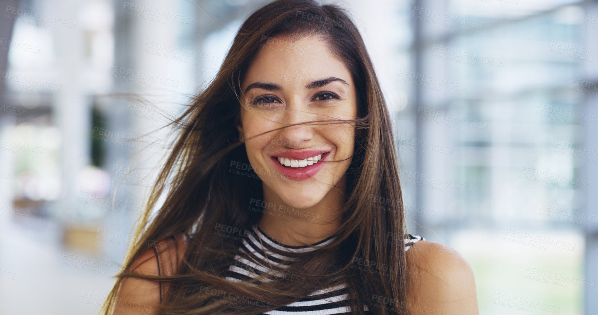 Buy stock photo Cropped shot of a confident young businesswoman walking through a modern office