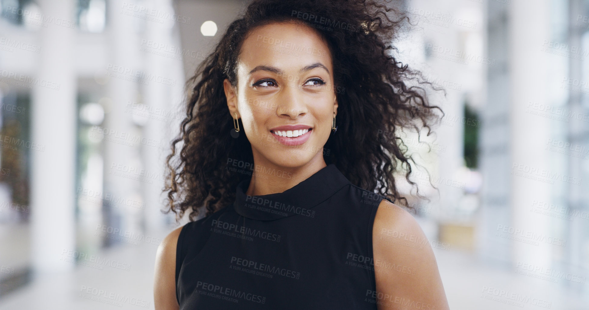 Buy stock photo Cropped shot of an attractive young businesswoman standing in her workplace