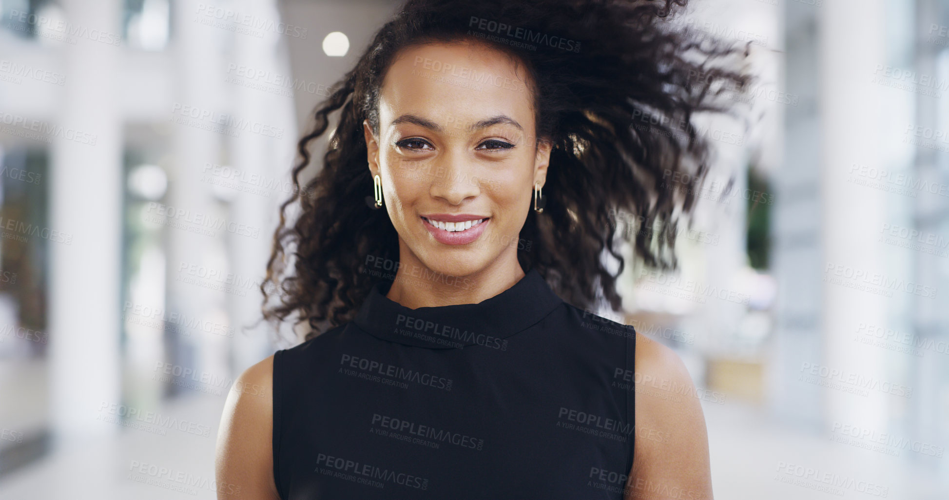 Buy stock photo Cropped shot of an attractive young businesswoman standing in her workplace