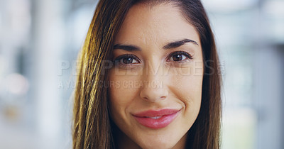 Buy stock photo Cropped shot of a confident young businesswoman walking through a modern office