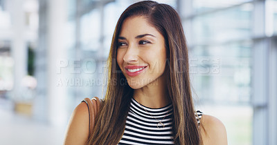 Buy stock photo Cropped shot of a confident young businesswoman walking through a modern office