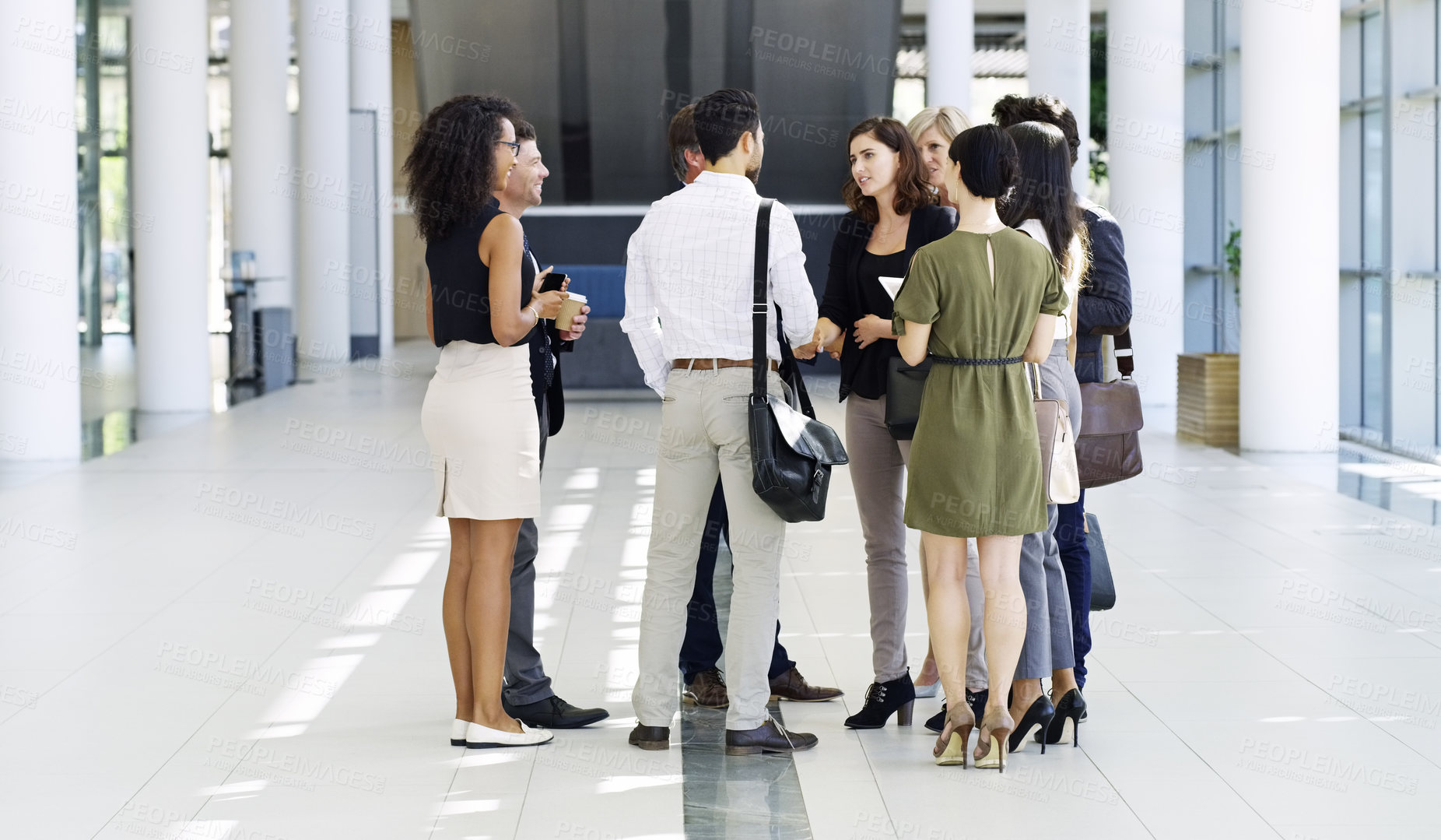 Buy stock photo Full length shot of a group of businesspeople standing in their workplace lobby