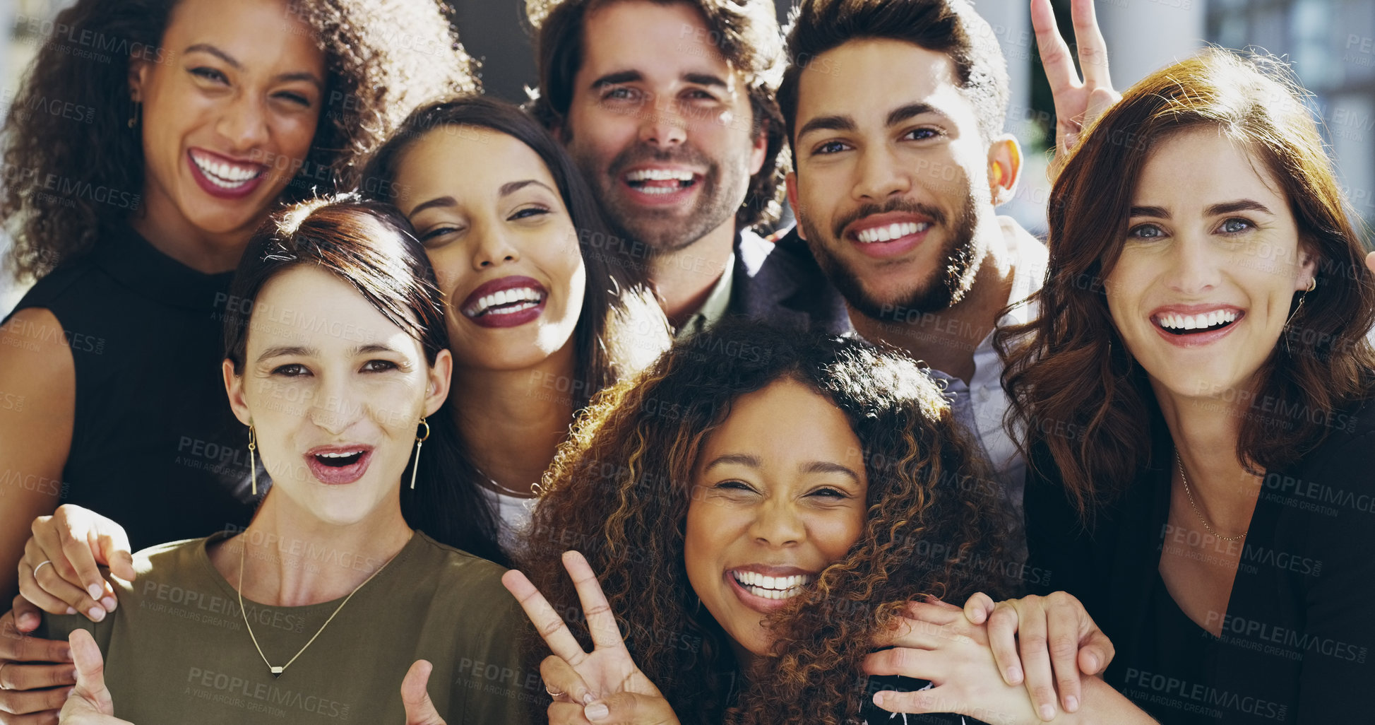 Buy stock photo Cropped shot of a group of businesspeople giving the peace sign while standing in their office