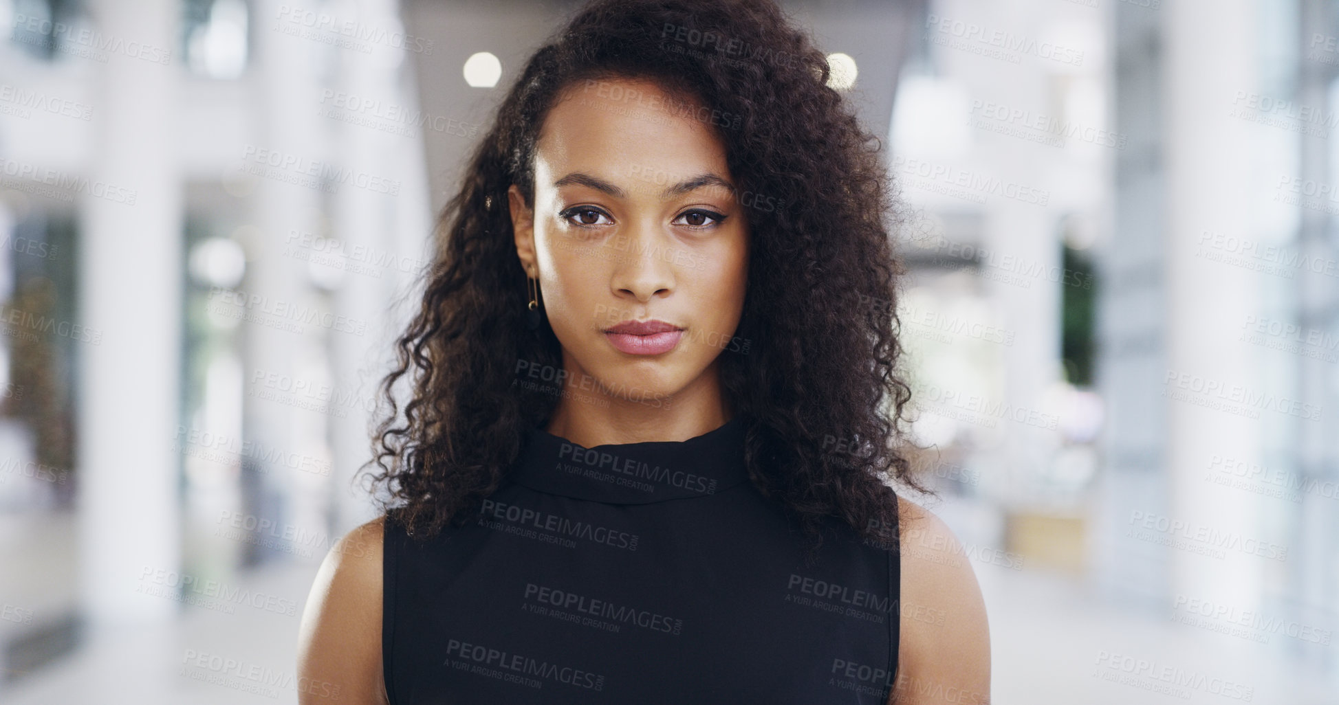 Buy stock photo Cropped shot of a confident young businesswoman working in a modern office