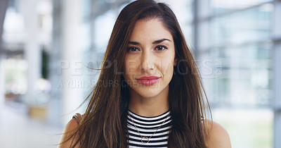 Buy stock photo Cropped shot of a confident young businesswoman working in a modern office