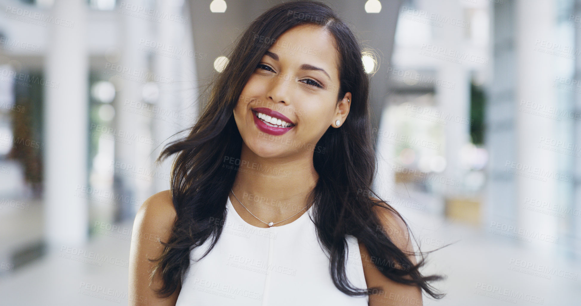 Buy stock photo Cropped shot of a confident young businesswoman working in a modern office