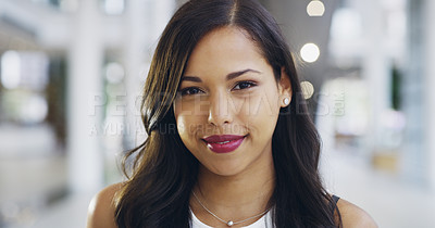 Buy stock photo Cropped shot of a confident young businesswoman working in a modern office