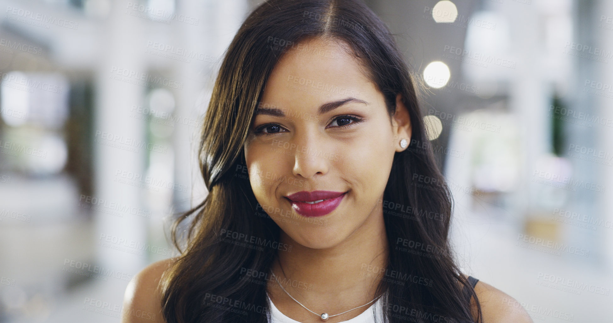 Buy stock photo Cropped shot of a confident young businesswoman working in a modern office