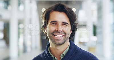 Buy stock photo Cropped shot of a young handsome businessman in a modern office
