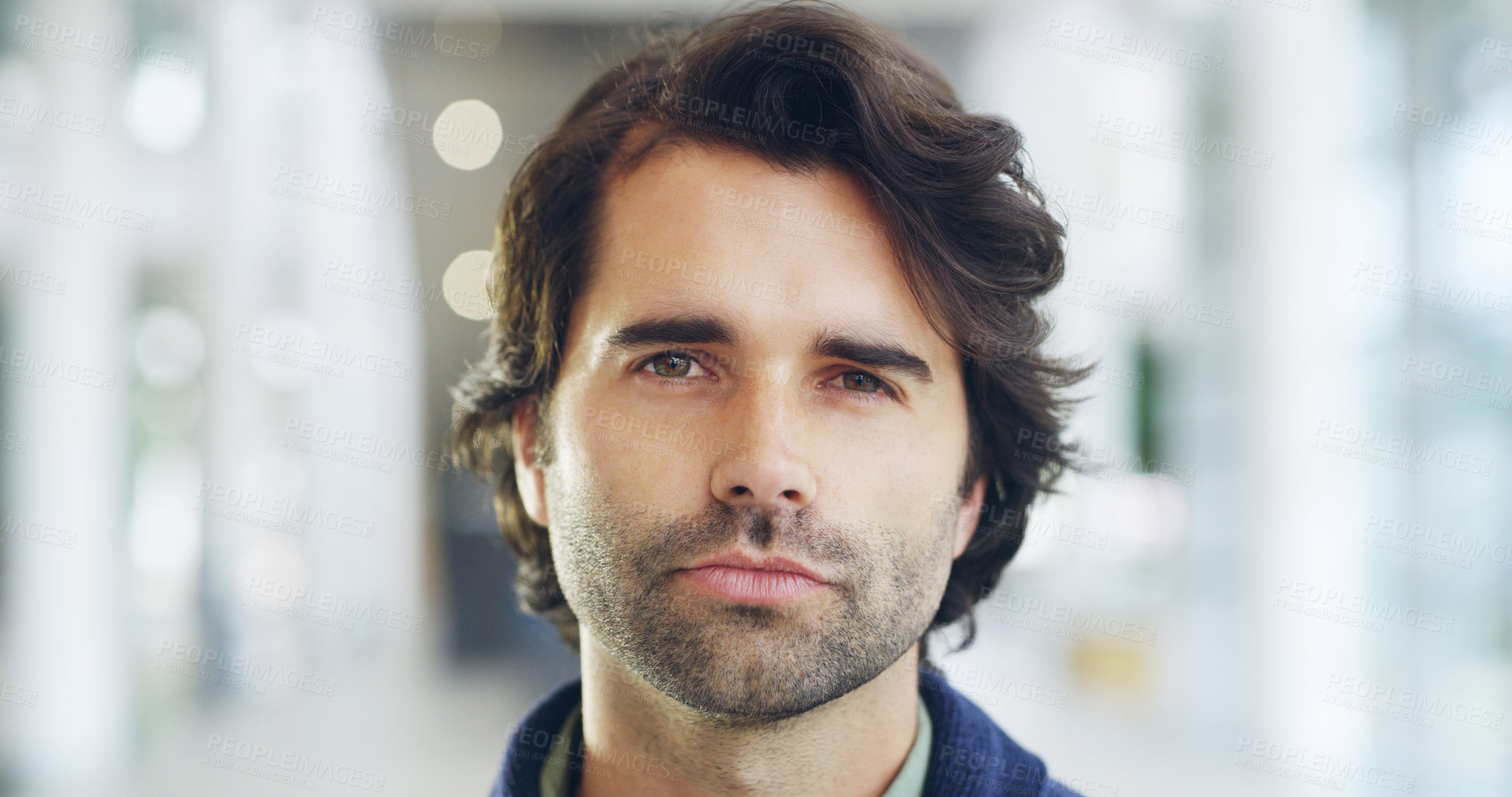 Buy stock photo Cropped shot of a young handsome businessman in a modern office