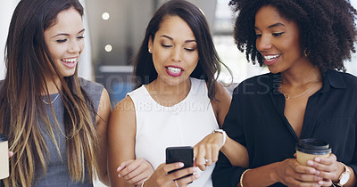 Buy stock photo Cropped shot of three young beautiful businesswomen walking through a modern office